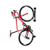 A black and red road bike stored in a classic road bike rack on a white background.