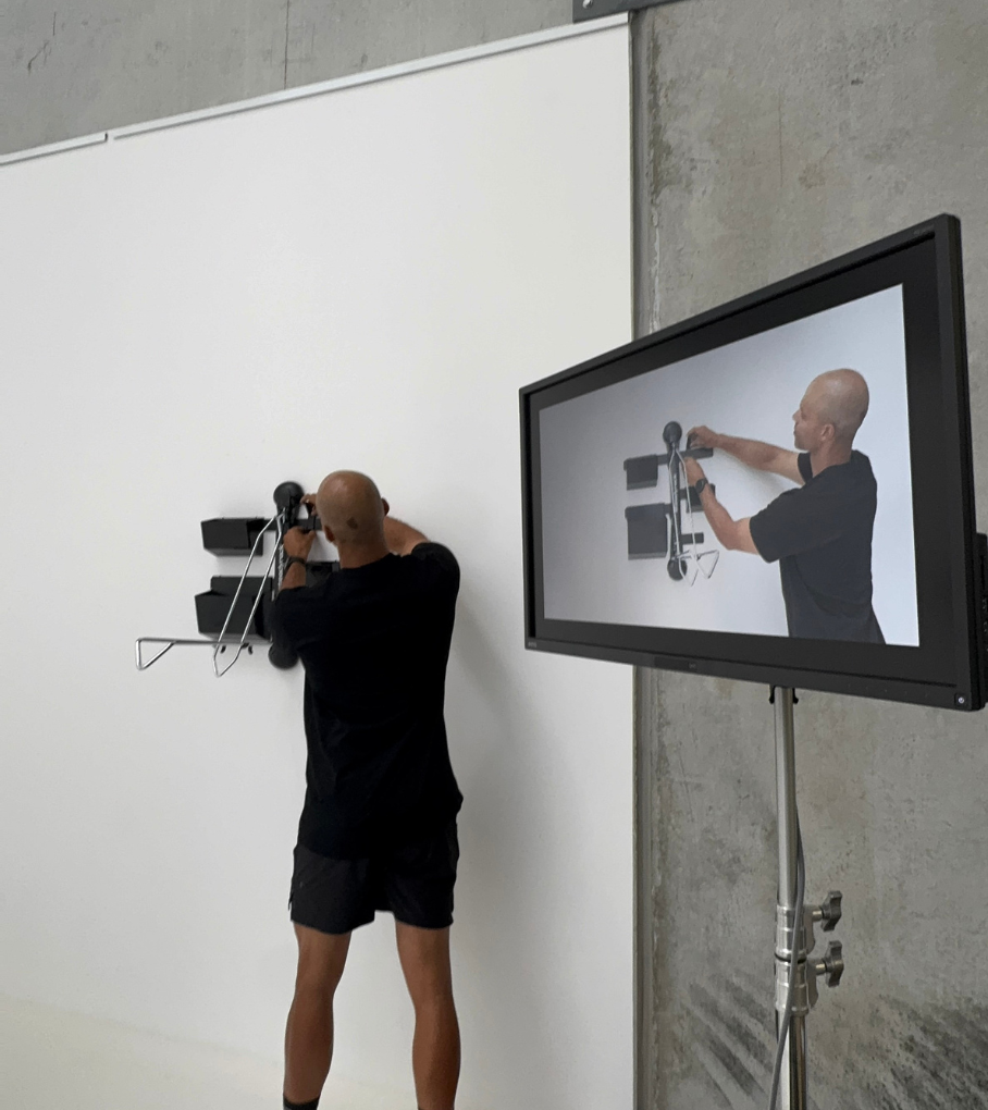 A person installing a GearMate system with a Steadyrack bike rack on camera.
