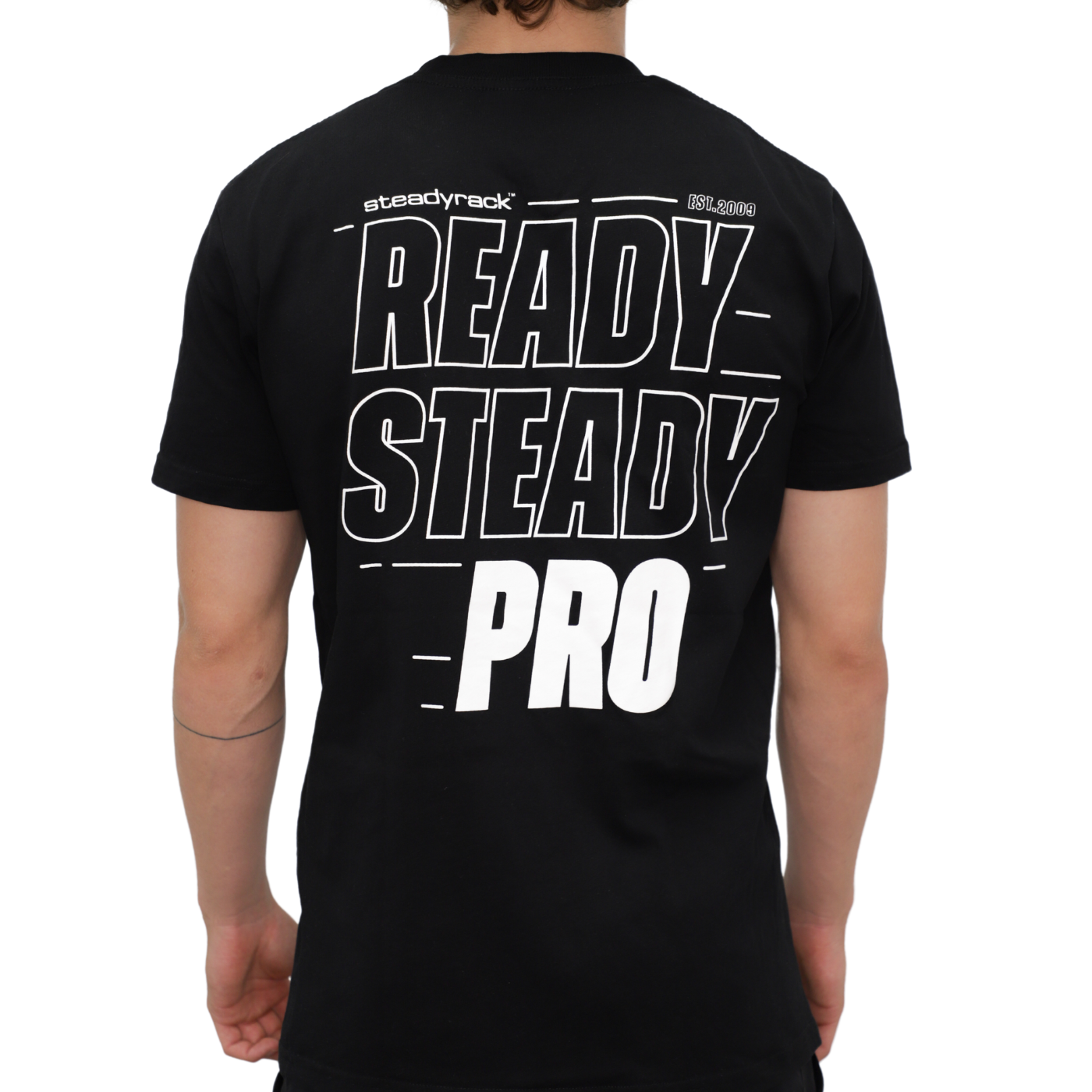 A model wearing a black t-shirt with a white Ready Steady Pro logo on the back.